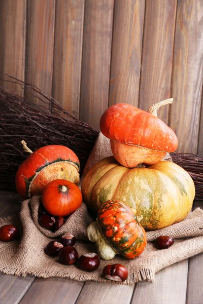 Pumpkins in box on sackcloth — Stock Photo, Image