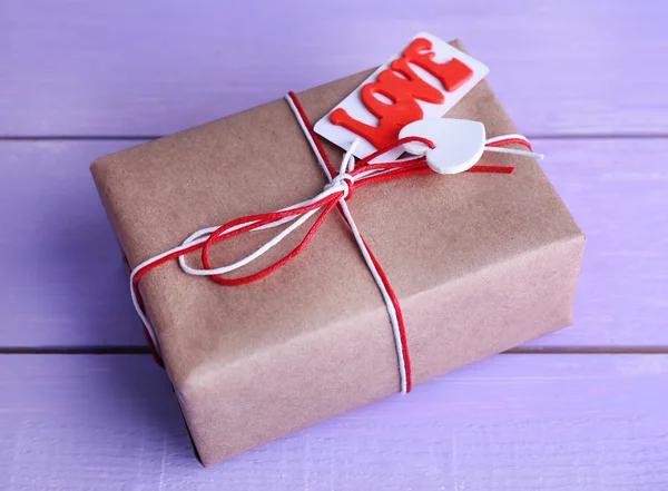 Gift box on wooden background — Stock Photo, Image