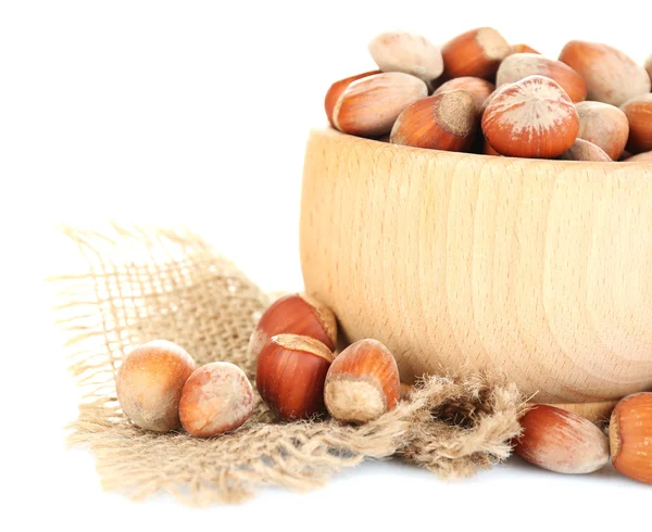 Hazelnuts in wooden bowl isolated on white — Stock Photo, Image