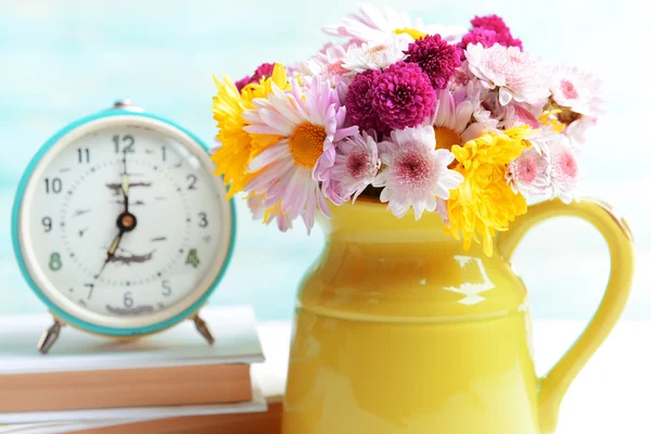 Beautiful flowers in pitcher — Stock Photo, Image