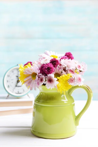 Beautiful flowers in pitcher — Stock Photo, Image