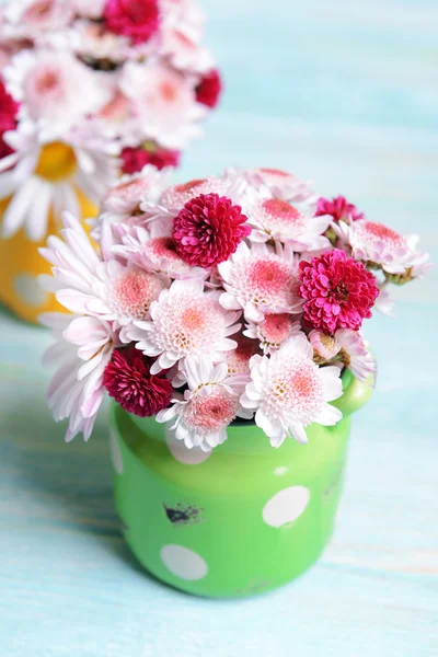 Beautiful flowers in cans — Stock Photo, Image