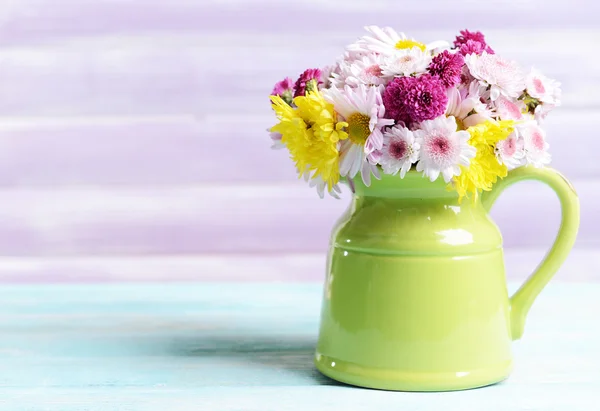 Beautiful flowers in pitcher — Stock Photo, Image