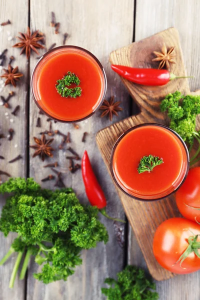 Tomato juice in glasses — Stock Photo, Image