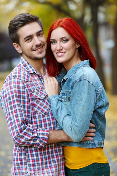 Loving couple in autumn park — Stock Photo, Image