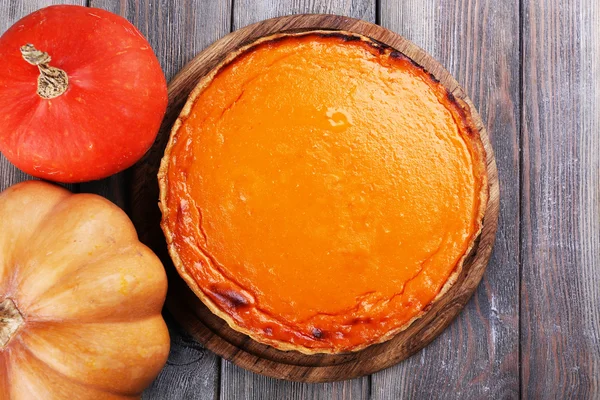 Homemade pumpkin pie on wooden background — Stock Photo, Image