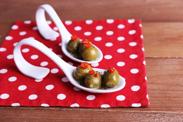 Green olives in oil — Stok fotoğraf