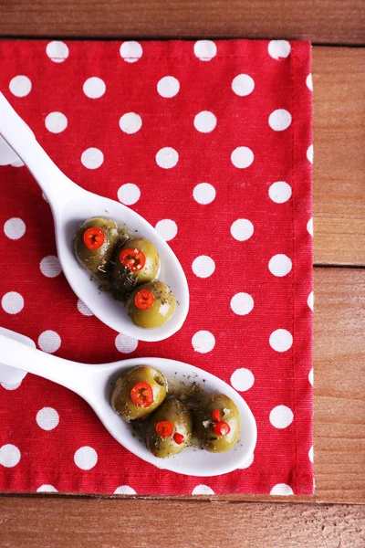 Green olives in oil — Stok fotoğraf
