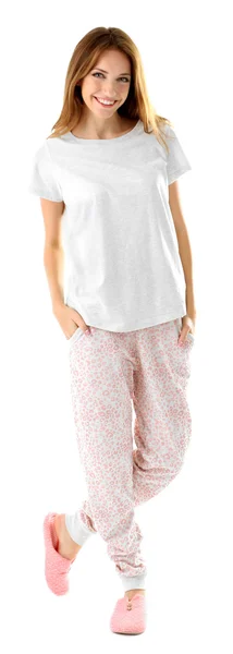 Vacker ung flicka i pyjamas isolerad på vit bakgrund — Stockfoto