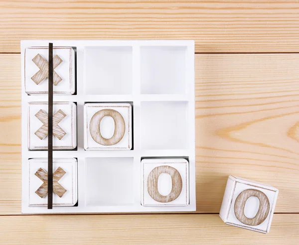 Game of Tic Tac Toe on wooden background — Stock Photo, Image