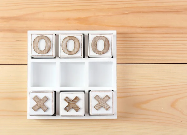 Game of Tic Tac Toe on wooden background — Stock Photo, Image