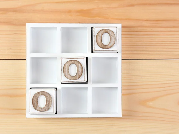 Game of Tic Tac Toe on wooden background — Stock Photo, Image