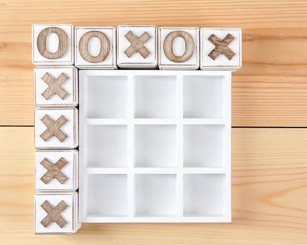 Game of Tic Tac Toe on wooden background — Stock Photo, Image