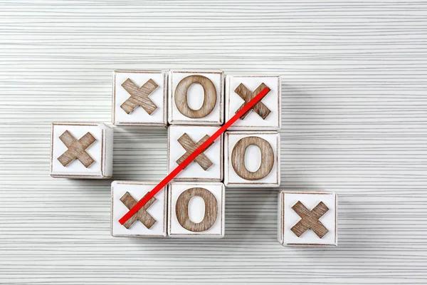Game of Tic Tac Toe on wooden background — Stock Photo, Image