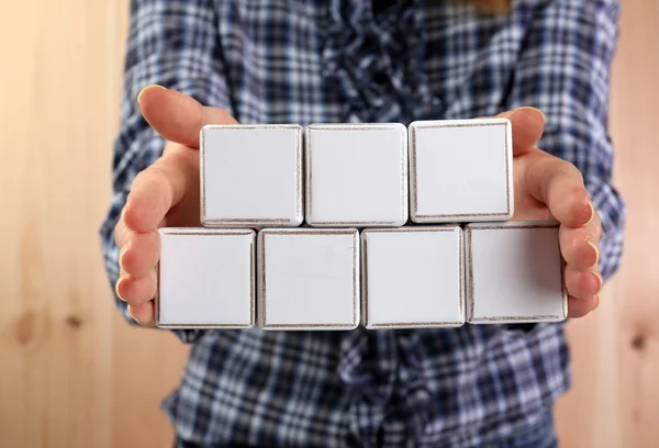 Educational cubes in hands — Stock Photo, Image