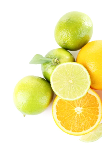 Fresh juicy limes and oranges isolated on white — Stock Photo, Image