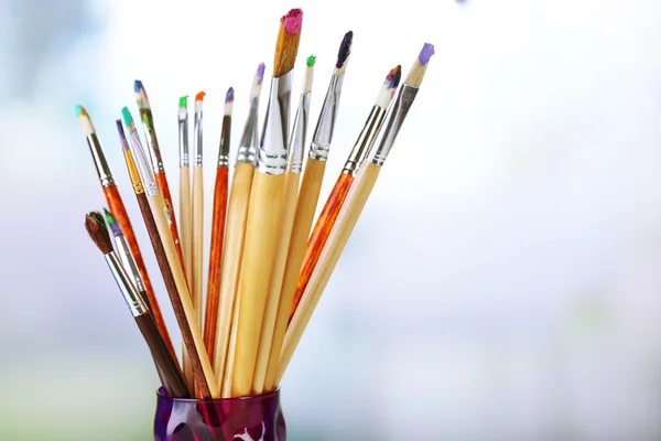 Paint brushes with paints — Stock Photo, Image
