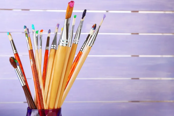 Paint brushes with paints — Stock Photo, Image