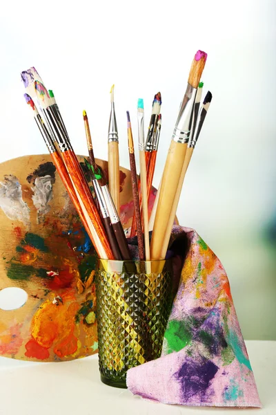 Paint brushes with paints — Stock Photo, Image