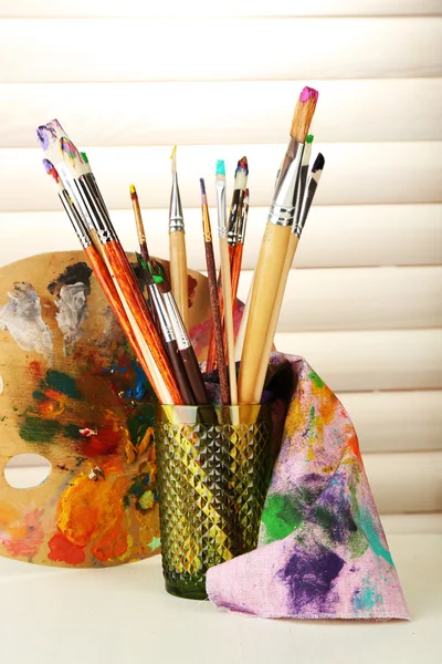 Paint brushes with paints — Stock Photo, Image