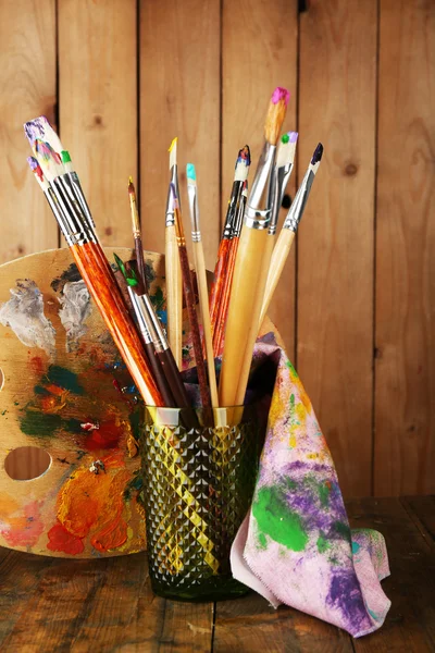 Paint brushes with paints — Stock Photo, Image