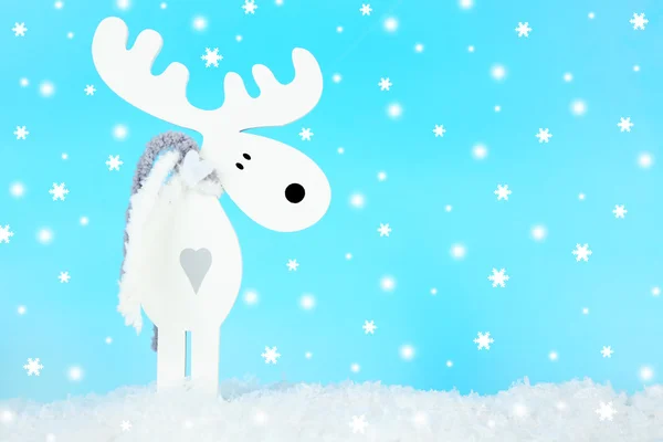 Christmas decoration in shape deer on light blue background — Stock Photo, Image