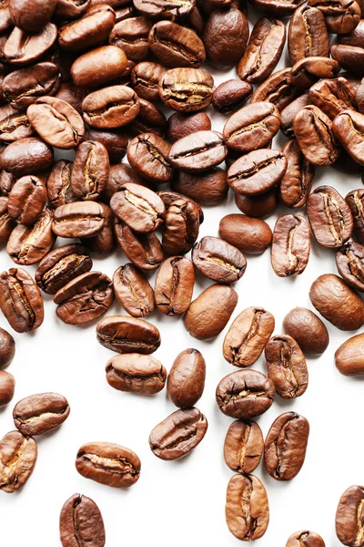 Coffee beans on white table, close-up — Stock Photo, Image