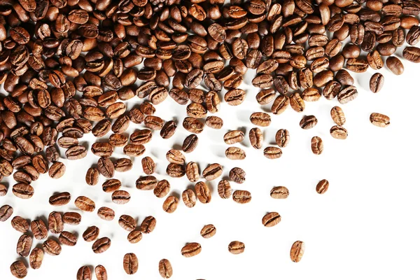 Kávová zrna na bílém stole, detail — Stock fotografie