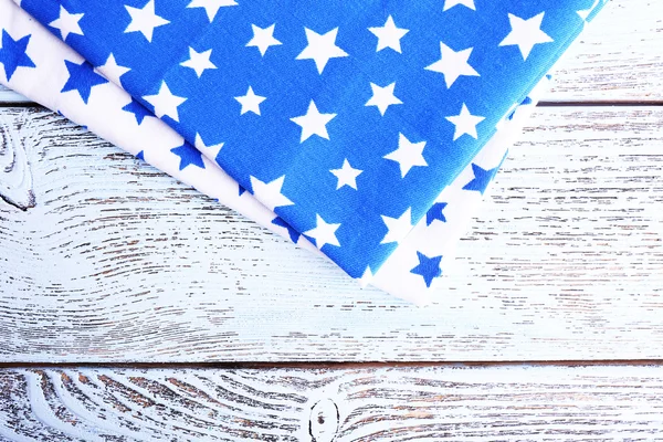 Blue napkins on wooden table — Stock Photo, Image