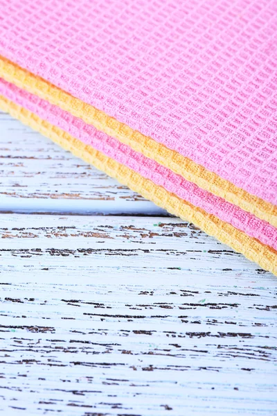 Colorful napkins on wooden table — Stock Photo, Image