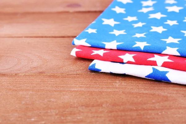 Colorful napkins on wooden table — Stock Photo, Image