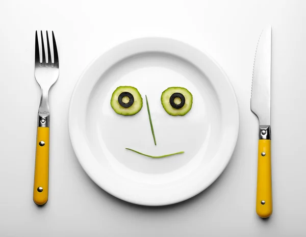 Vegetable face on plate — Stock Photo, Image