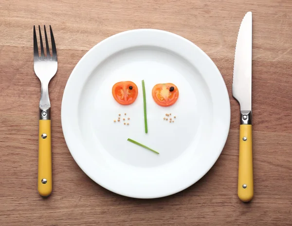 Vegetable face on plate — Stock Photo, Image