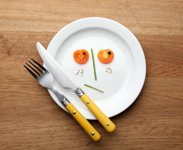 Vegetable face on plate — Stock Photo, Image