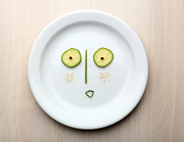 Vegetable face on plate — Stock Photo, Image