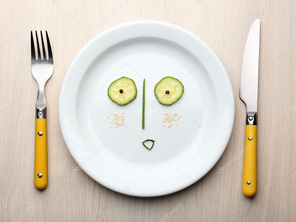 Vegetable face on plate