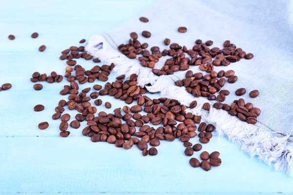 Coffee beans on jeans — Stock Photo, Image