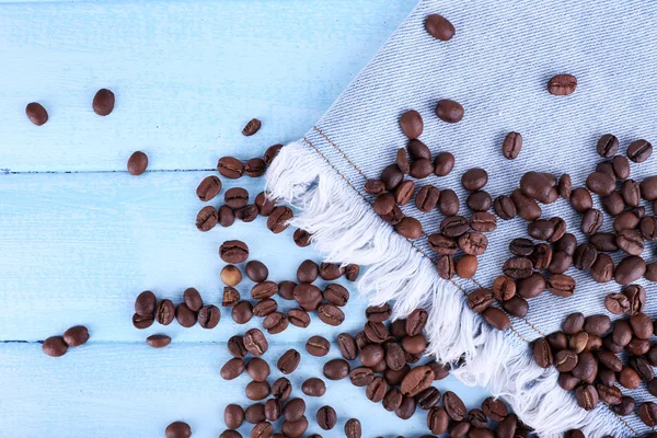 Coffee beans on jeans — Stock Photo, Image