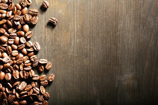 Coffee beans on wooden background — Stock Photo, Image