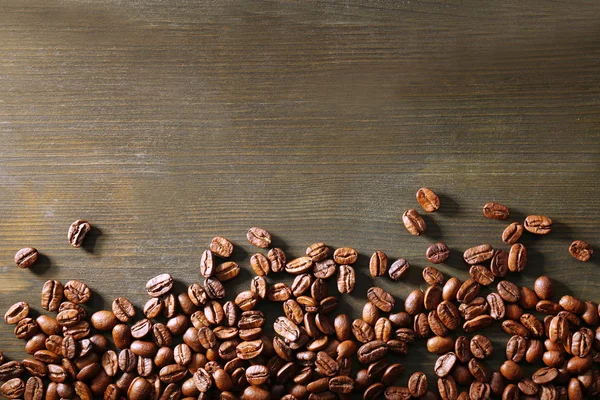 Coffee beans on wooden background — Stock Photo, Image