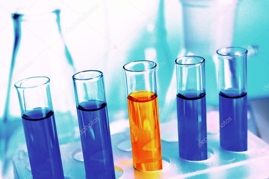 Test-tubes filled with color fluid close-up