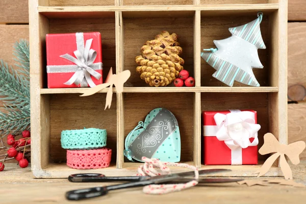Christmas gifts in wooden crate — Stock Photo, Image