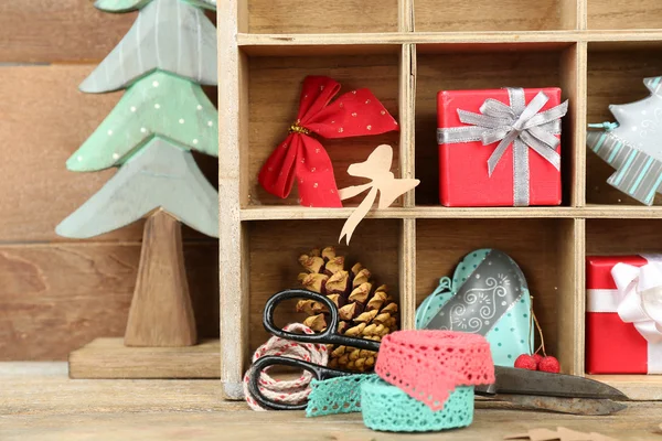 Christmas gifts in wooden crate — Stock Photo, Image