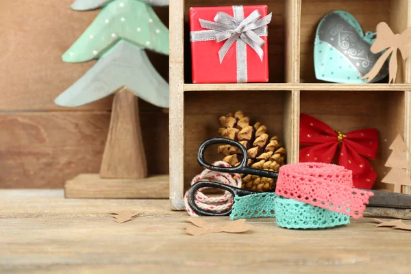 Christmas gifts in wooden crate — Stock Photo, Image