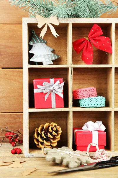 Christmas gifts in wooden crate — Stock Photo, Image