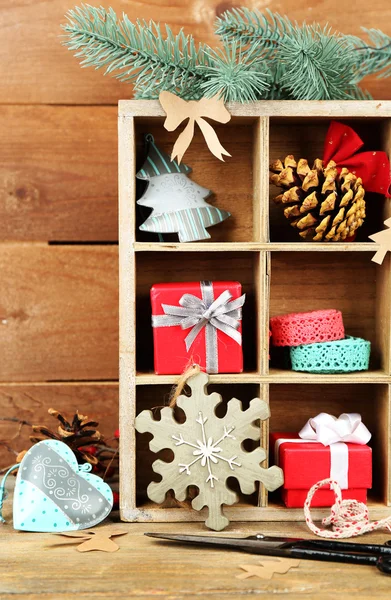 Christmas gifts in wooden crate — Stock Photo, Image