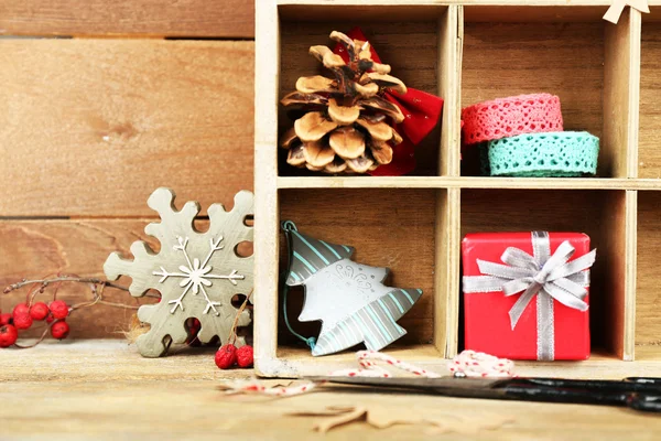 Christmas gifts in wooden crate — Stock Photo, Image