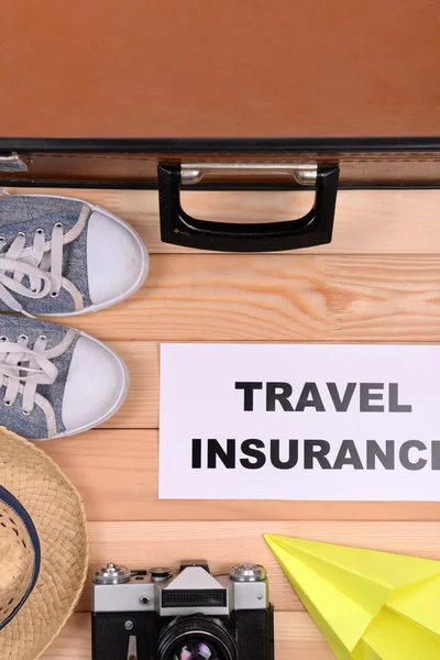 Suitcase and tourist stuff — Stock Photo, Image