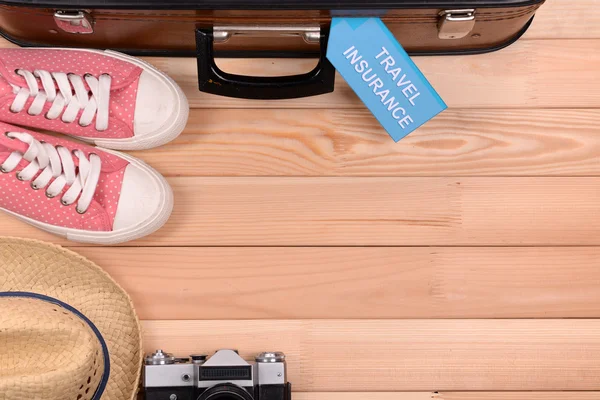 Suitcase and tourist stuff — Stock Photo, Image