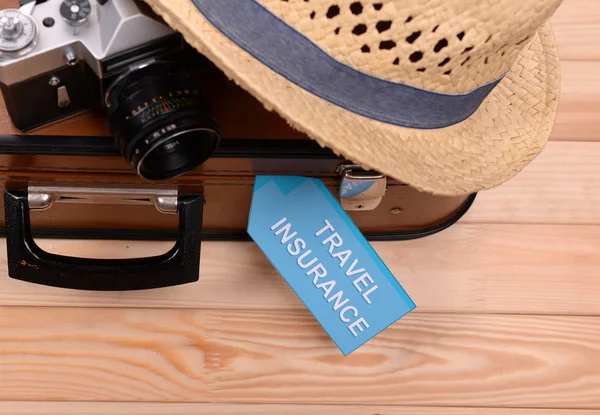 Suitcase and tourist stuff — Stock Photo, Image